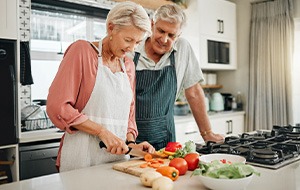 An older couple preparing healthy food to eat