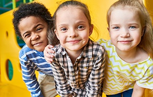 Child in Jacksonville smiling with friends